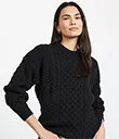 A20290BLACK Merino Crew Neck Aran Sweater Front Lifestyle Gaelsong 