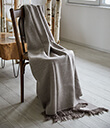 Oxford Brown Herringbone Throw of Merino Wool Lifestyle on Chair Gaelsong