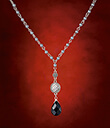 Drop of Black Necklet on Red Background Gaelsong