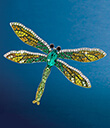 Emerald Crystal Dragonfly Pin on Blue Background Gaelsong