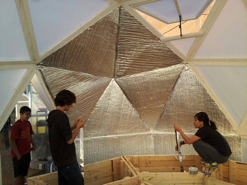 Inside the dome greenhouse structure students learn to grow food