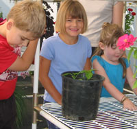 School kids in a Solexx Conservatory greenhouse