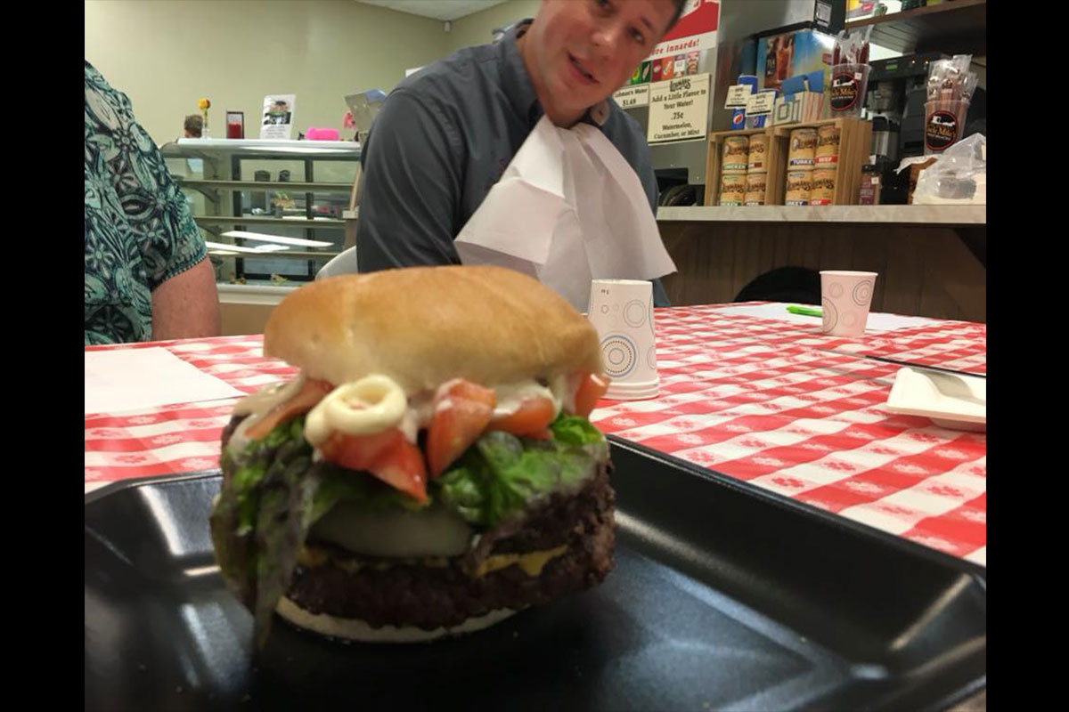 Who wouldn't want this job - taste testing the unique burgers, hot off the grill.