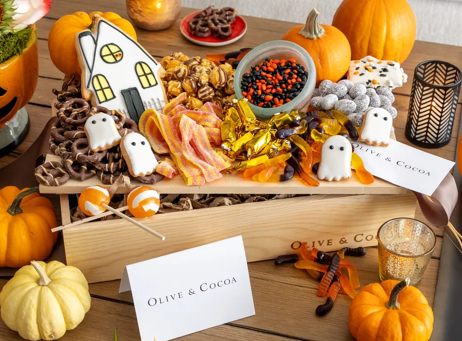 Halloween treats crate with ghost cookies and candy