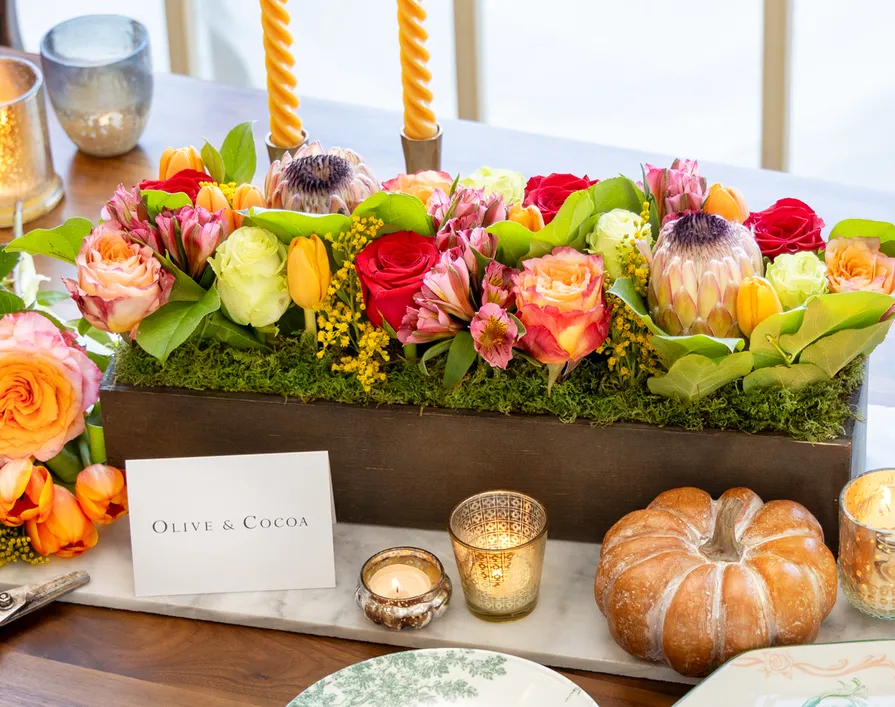 Autumn floral centerpiece with roses and protea