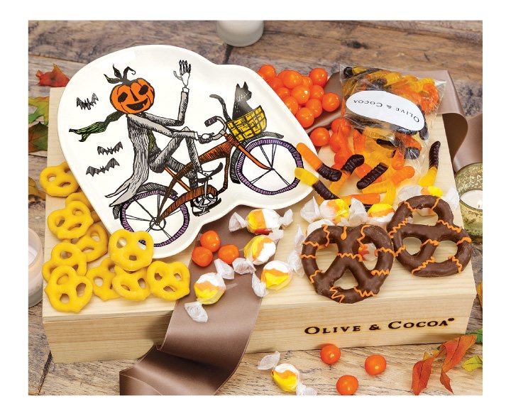 An image of Olive & Cocoas sleepy hollow plate and sweets halloween gift basket.