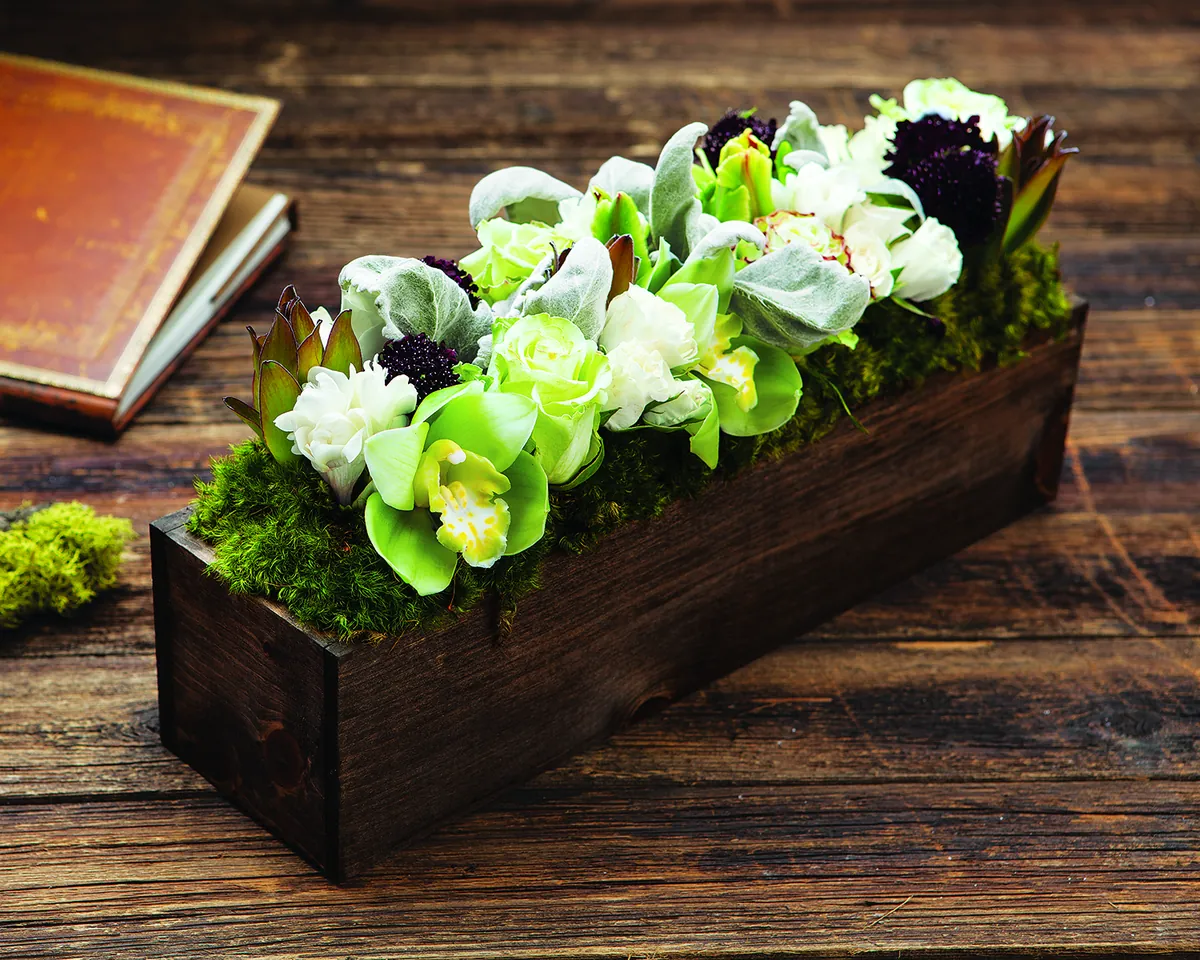 Bianca Grace: white and pale green blossoms arranged in a long wood planter box