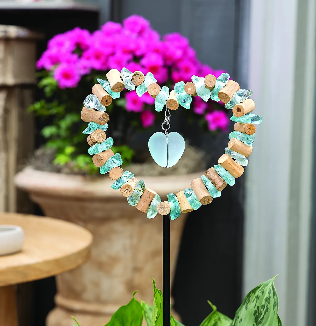 Sea Glass & Heart Garden Stake: a heart of aqua sea glass and driftwood with a suspended glass heart