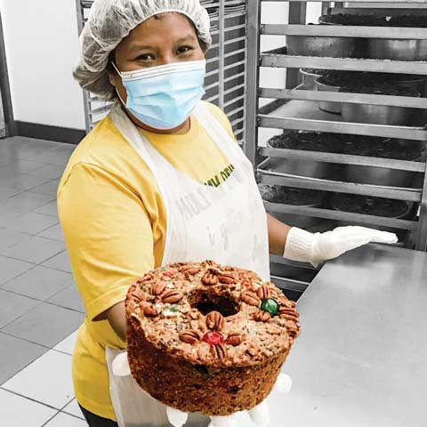 Freshly baked pecan pies with golden brown crust and pecans on top.