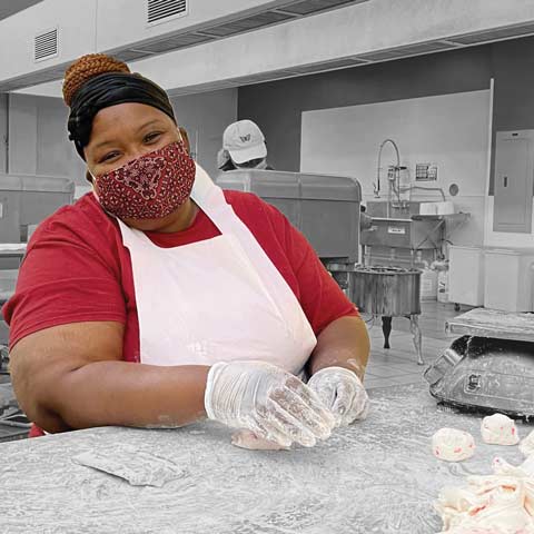 Woman sorting pecans