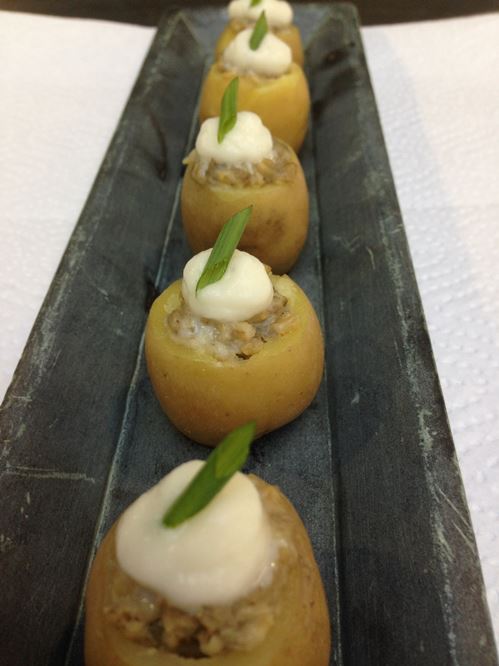 Baby potatoes stuffed with haggis and topped with a dollop of crème fraiche