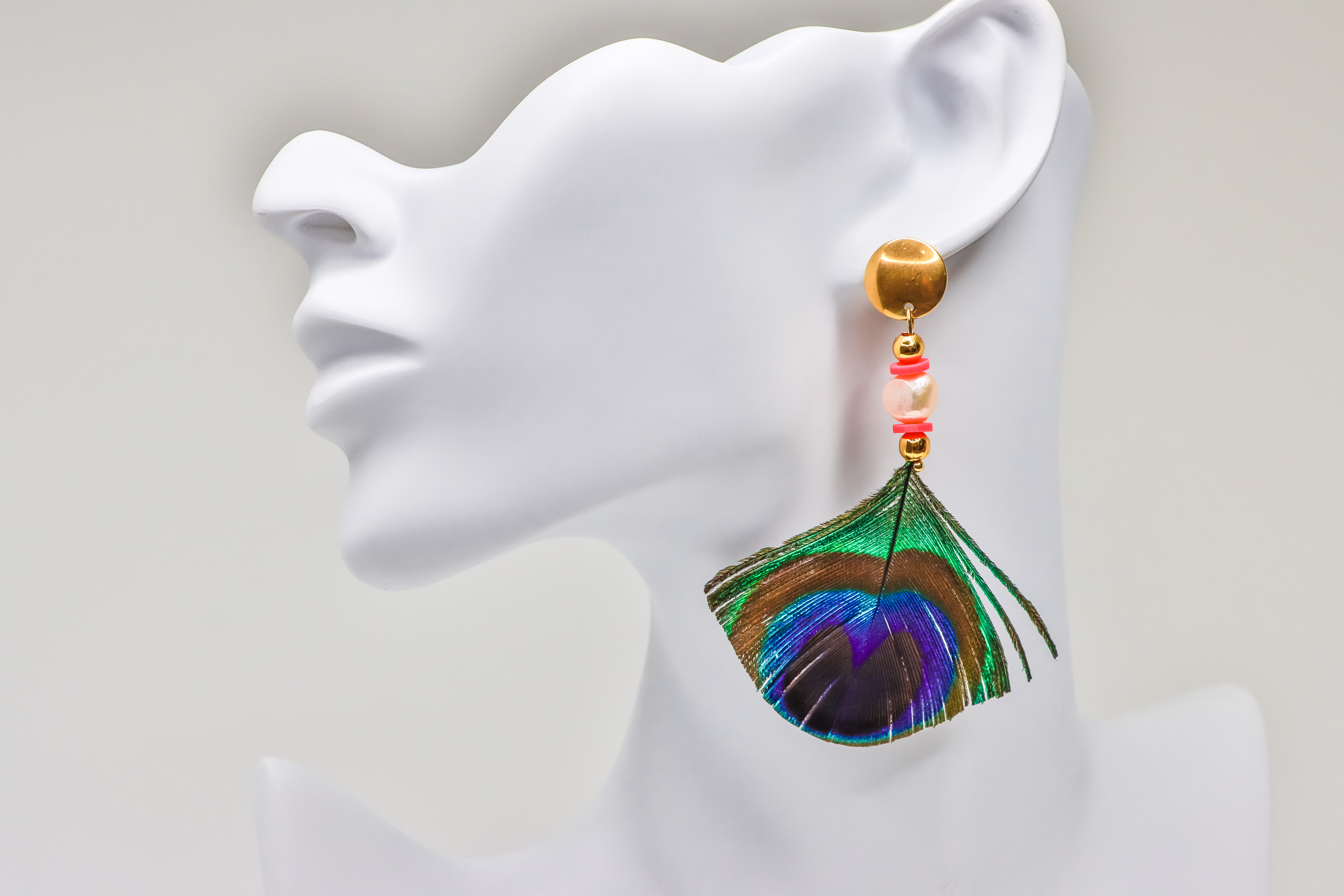 Peacock Feather Earrings on White Wooden Background Stock Photo - Image of  accessory, africa: 120019638